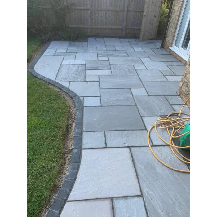 An image of Kandla Grey Indian Sandstone Paving laid out to show what it looks like.