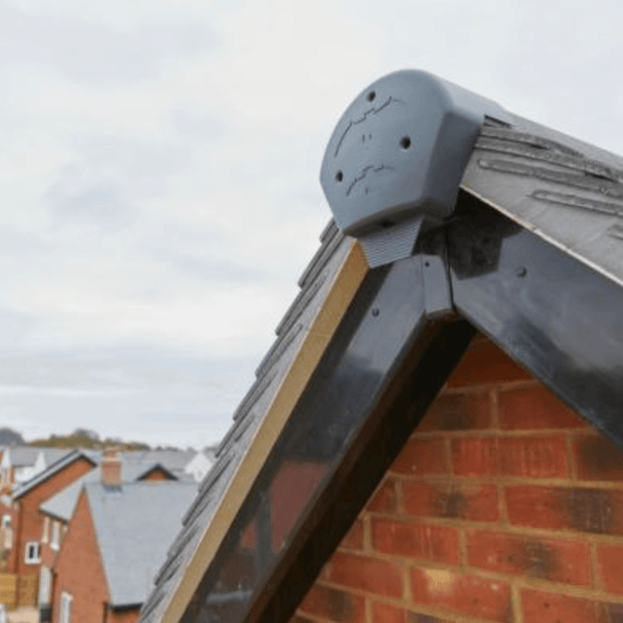 Image of a grey bat box ridge end cap on the side of a house to show what it would look like