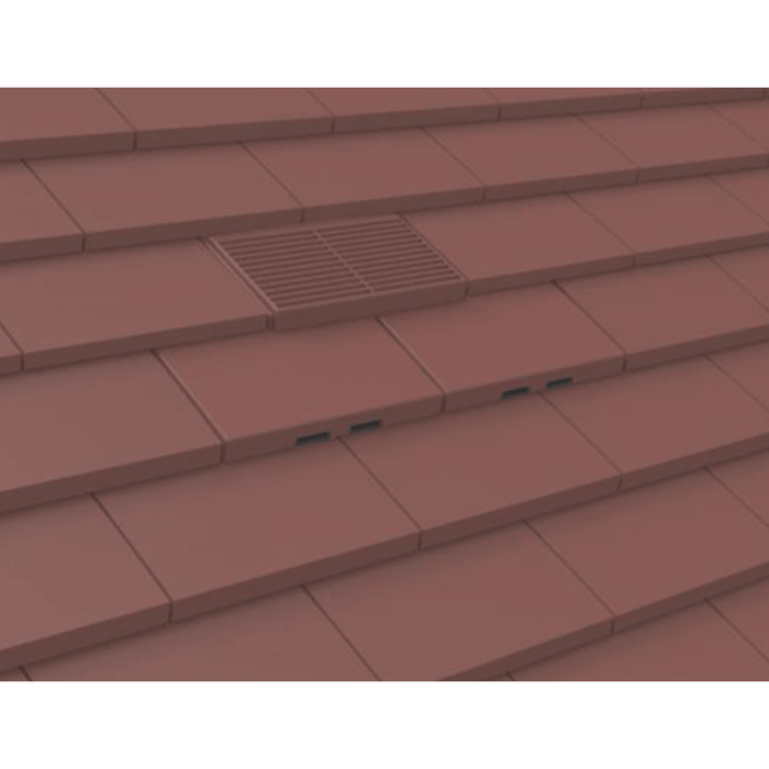 An image of Manthorpe Plain Tile Vent in Antique Red on a roof to show the finish.