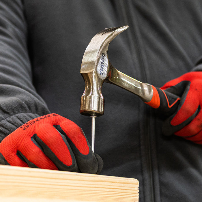 An image of a 16oz Claw hammer from  Timco being used to drive in a nail.