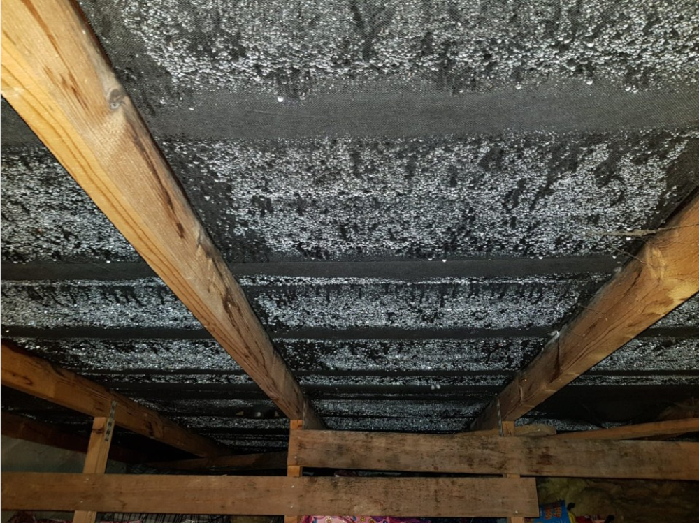An image of condensation in a loft / attic / roof space