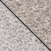 An image showing Artico White Marble Stone Aggregate Gravel. The image is split horizontally to show the difference between wet and dry.