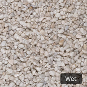 An image showing Artico White Marble Stone Aggregate Chippings when Wet