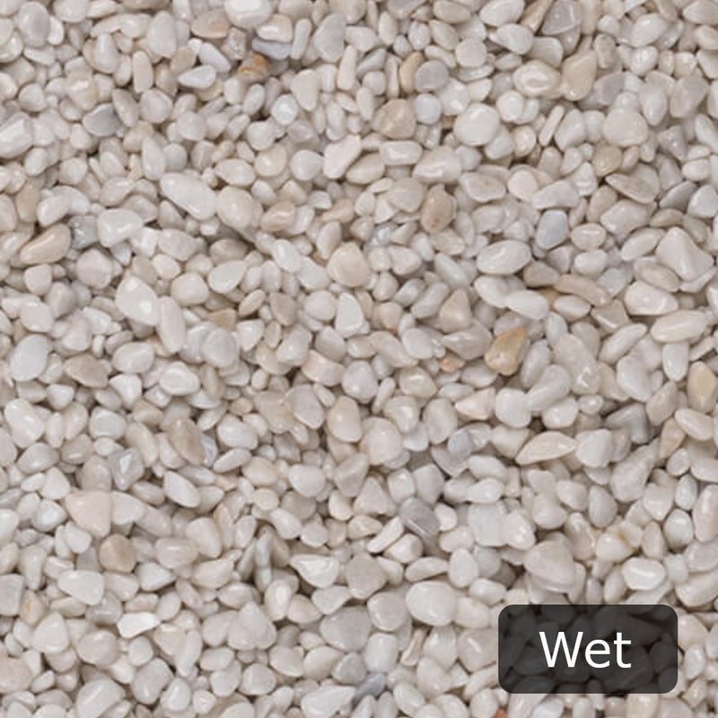 An image showing Artico White Marble Stone Aggregate Chippings when Wet