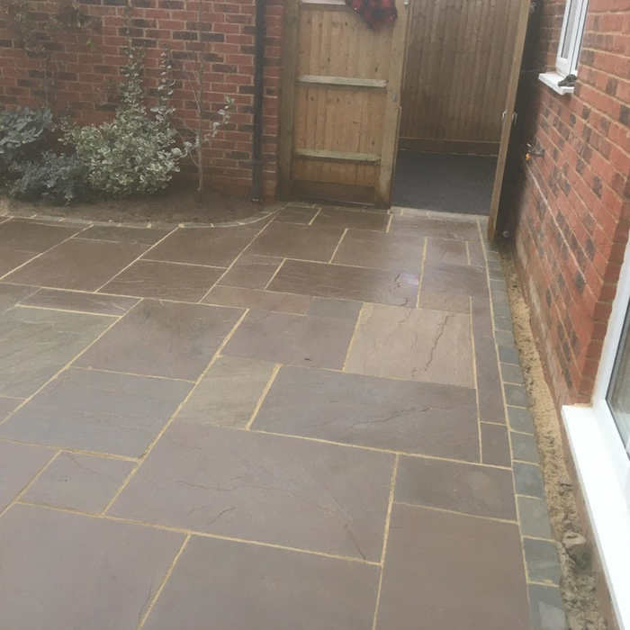 An image of Autumn Brown Indian Sandstone Paving laid out to show how it looks.