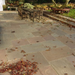 An image of Autumn Brown Indian Sandstone Paving laid out to show how it looks in a shady area.