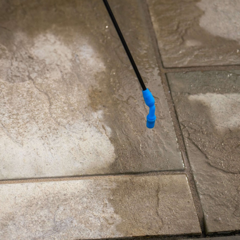 An image showing Azpects EASY Patio Joint Repair in the colour Grey Beige being sprayed gently into gaps in paving to solidify it.