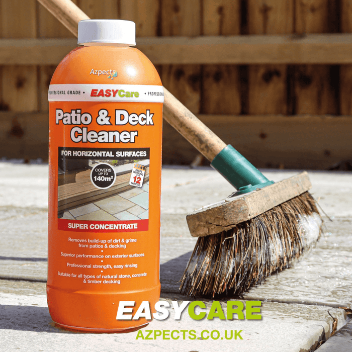 An image of Azpects EASYCare Patio & deck cleaner in a 1 litre bottle on a patio with a brush with the product on it.