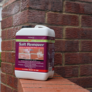 An image of a wall being treated with Azpects EASYCare Salt Remover with the 3 litre bottle.