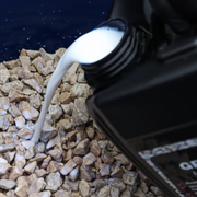 An image showing Azpects EASYScape Gravel Hold being poured onto some stone chippings / gravel / aggregates.