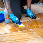 An image of Azpects EASYSeal Natural Stone Intensifier being applied with a sponge applicator.