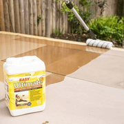 An image of Azpects EasySeal Ultimate being applied to paving with the tub in the foreground.