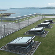 An image showing four Azure Vented flat roof windows FRE B600. The image is from the outside to show how they can be decorated to fit in with the surroundings.