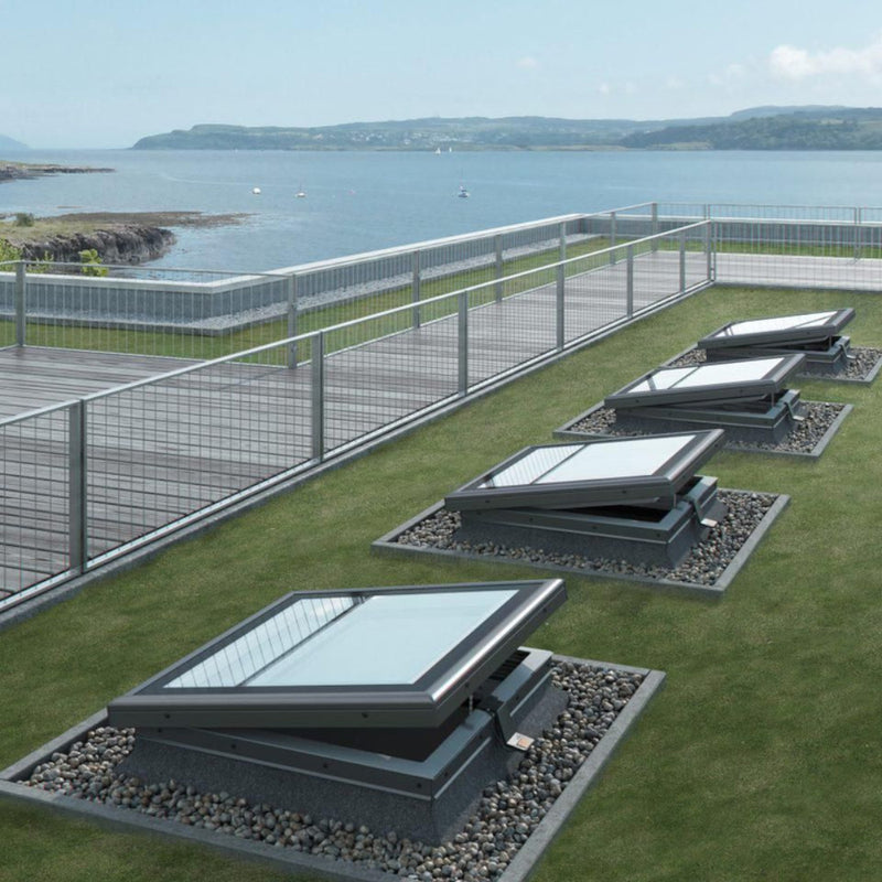 An image showing four Azure Vented flat roof windows FRE B600. The image is from the outside to show how they can be decorated to fit in with the surroundings.