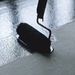 An image of Bitumen and flashing prier being applied with a roller to a surface.