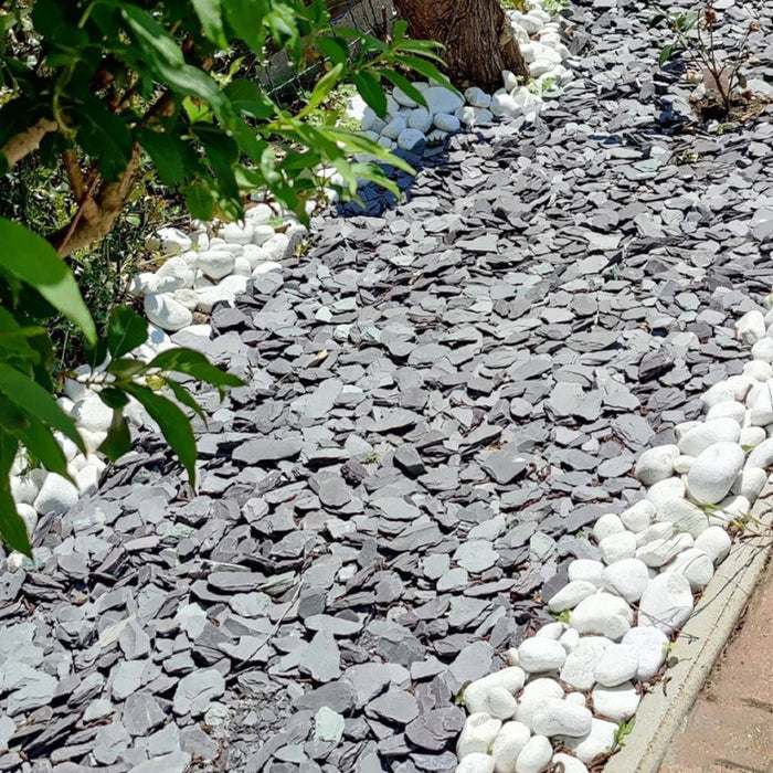 An image of Blue Slate Chippings when laid as a garden path