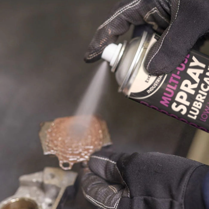 An image of Bond-It Multi-Use Spray Lubricant being used to treat some rust