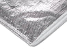 A close up image of a cross section of YBS BreatherQuilt insulation against a white background to show the layers in the foil insulation.