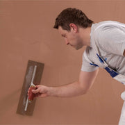 An image of  Thistle Multi Finish Plaster: 25kg from British Gypsum being applied to a wall with a plastering trowel