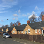 An image of a row of houses covered with Britmet Lightweight Metal Roof Tile Slate 2000