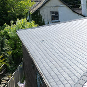 An image of a roof with Britmet LiteSlate Tiles and with a Vent build in.