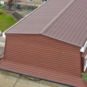 An image of roof fitted with Britmet Pantile 2000 tiles with Eave Flashing strip.