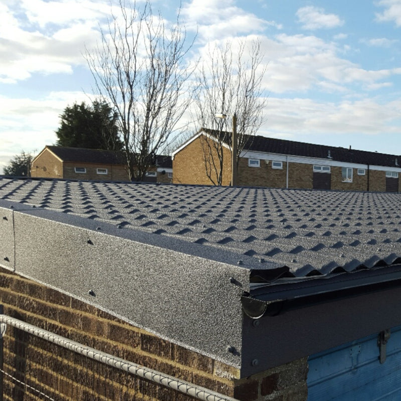 An image of roof fitted with Britmet Pantile 2000 tiles with Eave Flashing strip.