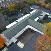 An image showing a school fitted with Britmet Pantile 2000 Roof Tiles with Mono Ridge on the hips and ridge.