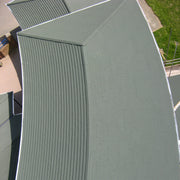An image showing a curved roof with Britmet Plaintile Lightweight Roof Shingles