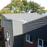 An image showing a roof with Britmet Plaintile Lightweight Roof Shingles that are also being used as cladding.