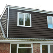 An image showing the side of a building cladded with Britmet Plaintile Lightweight Shingles
