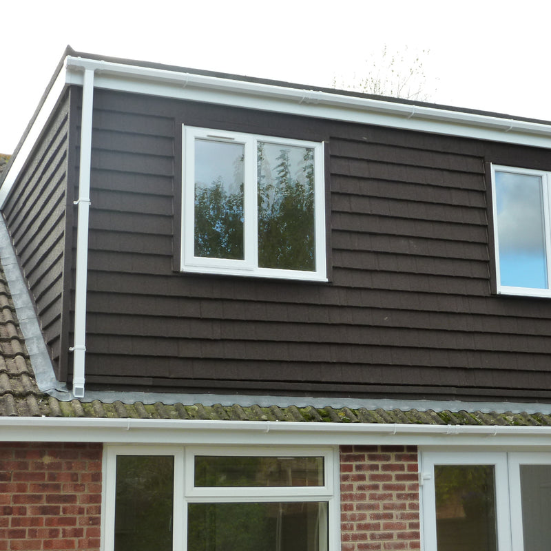 An image showing the side of a building cladded with Britmet Plaintile Lightweight Shingles