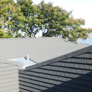 An image of a roof showing a Britmet Plaintile Roof with Verge Barge installed 