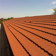 An image of a low pitched roof with Britmet Profile 49 Roof Shingles 