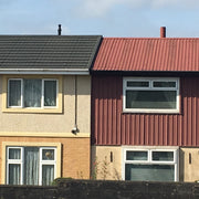 An image of a roof with Britmet Profile 49 tiles and finished with Mono Roof Ridge tiles.