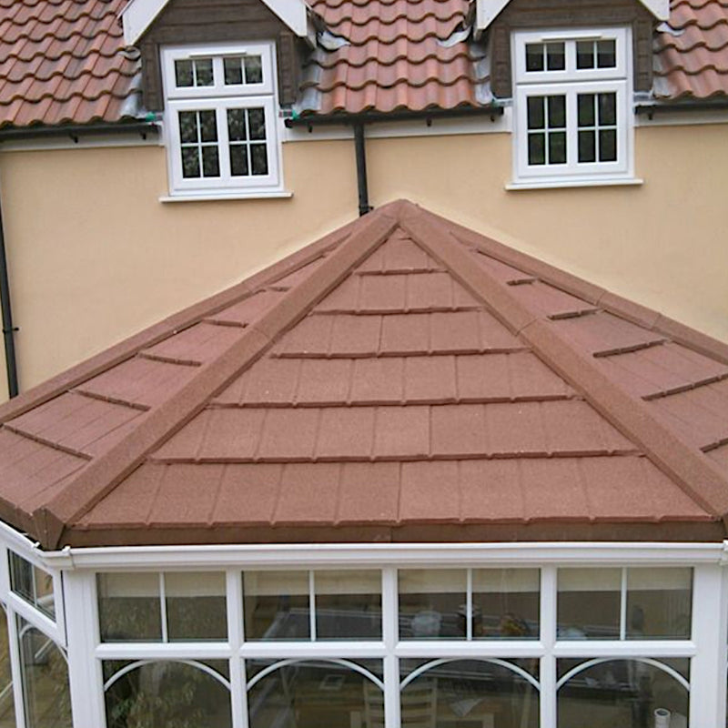 An image of a conservatory roof with Britmet Roof Shingle Universal Top Cap fitted