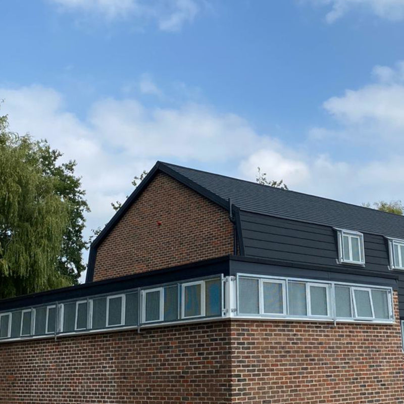 An image of a roof with Lightweight Shingles and Two-Part Roof Barge Soakers