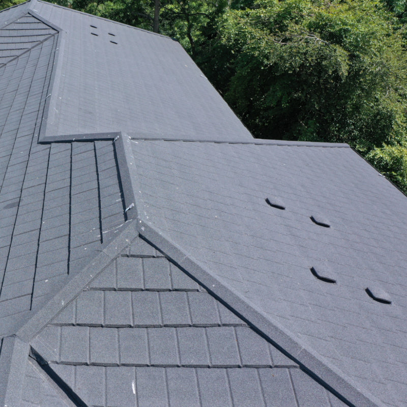 An image showing a large roof fitting with Britmet Slate 2000 Roof Tiles and Slate Vent