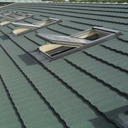 An image showing a roof fitted with Britmet Ultratile Shingles around skylight windows.