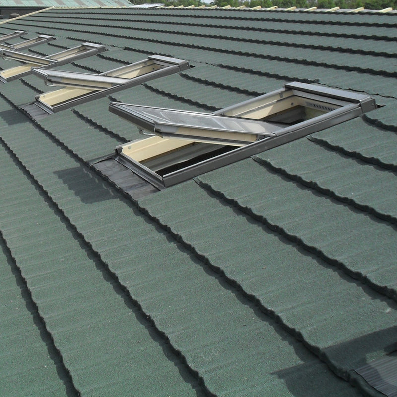 An image showing a roof fitted with Britmet Ultratile Shingles around skylight windows.