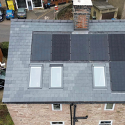 Roof with solar panels and windows with Chinese slate.