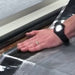 An image of ClassicBond Pressure Sensitive Seaming Tape being applied to a join / seem in rubber.