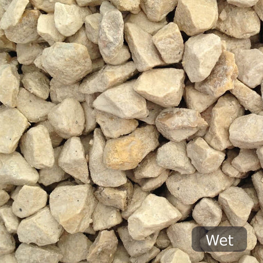 An image of Cotswold Buff Stone Chippings when they are wet