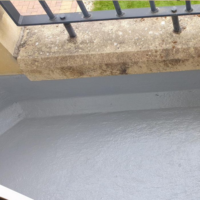 An image of a roof that has had Cromapol Acrylic Roof Coating in Grey applied and shows the smart finish that is waterproof.