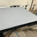 An image of a roof that has had Cromapol Acrylic Roof Coating in Grey applied and shows the smart finish that is waterproof.