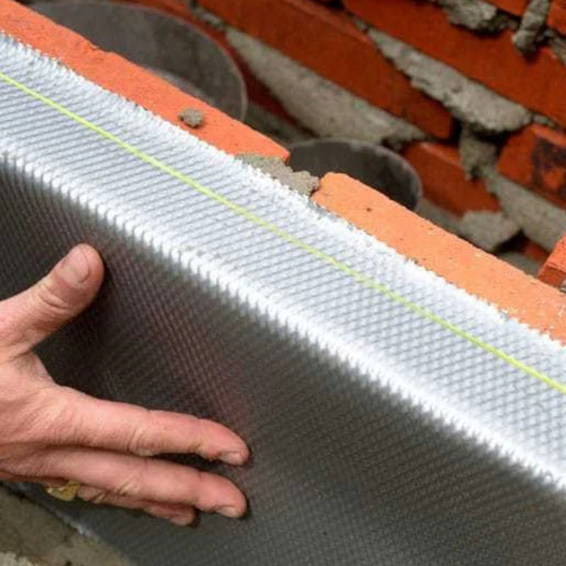 An image of Leadax being fitted on the side of a house using Fixing Sealant.