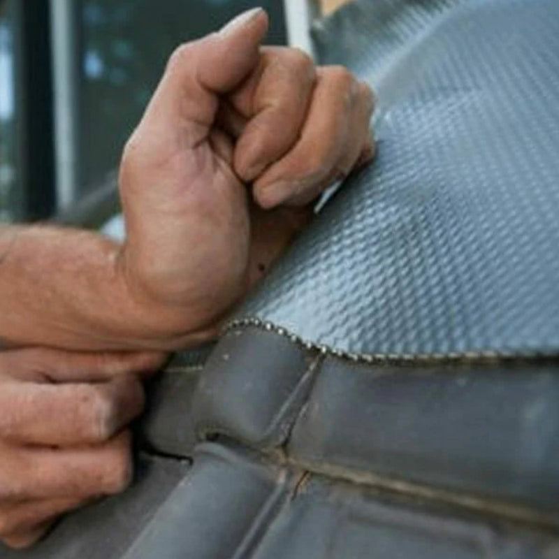 An image of Leadax being fitted on the side of a house using Fixing Sealant.