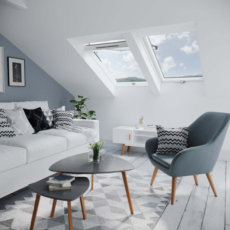 An image of a Dakea Better View High Pivot Roof Window KHV B1010 fitted into a living room to show how it would look.