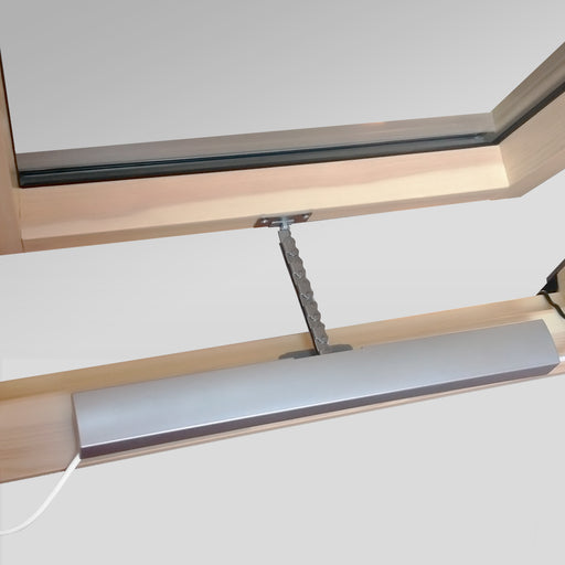 An image showing a Dakea Electric Opener AMC 100, attached to a window to show what it looks like.