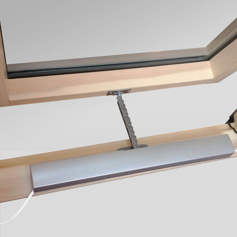 A close up image of a Dakea Electric Opener AMC 100 installed onto a window, showing what it looks like when open.